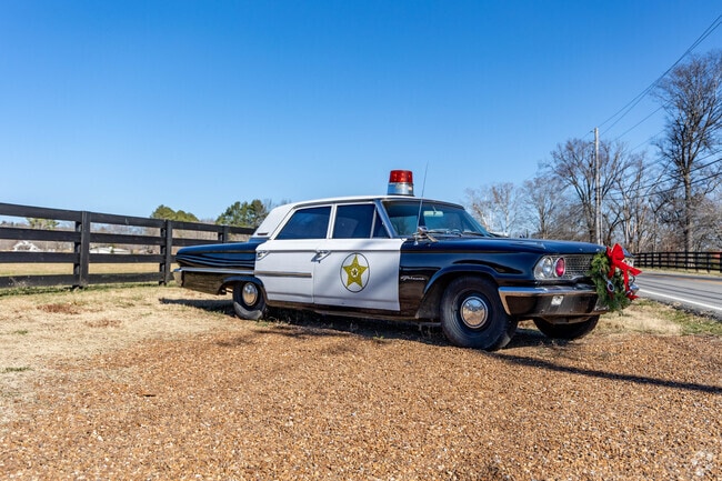 A vintage police car from Andy Griffith is displayed in Leiper's Fork.