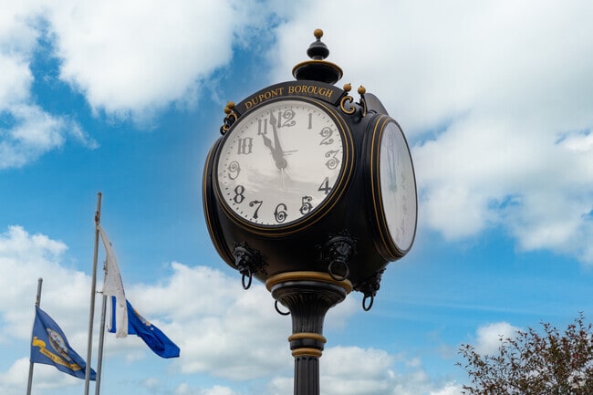 This antique clock stands outside the Dupont Municipal Building.