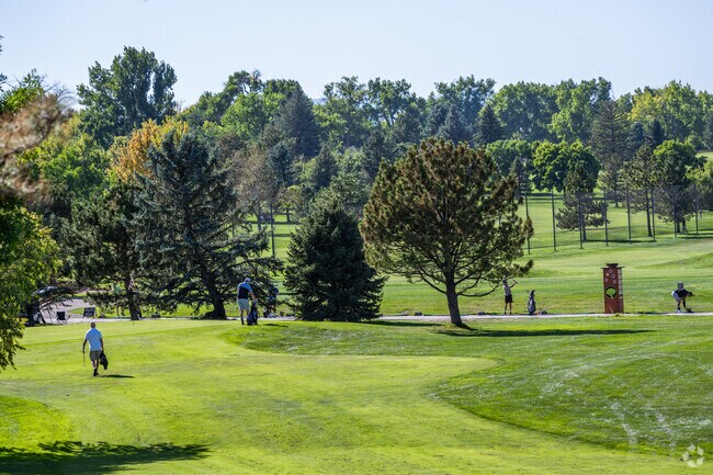 Golfers enjoy the beautifully kept green at Indian Tree Golf Club near Parkway Estates, Arvada,