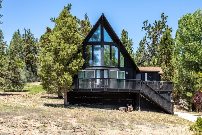 A stunning black A-frame cabin stands as a captivating and picturesque in Big Bear City.
