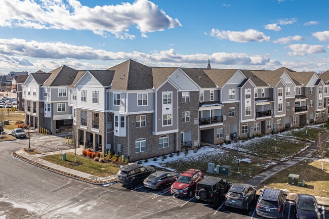 Parking spaces and attached garages line the Harbortown community.