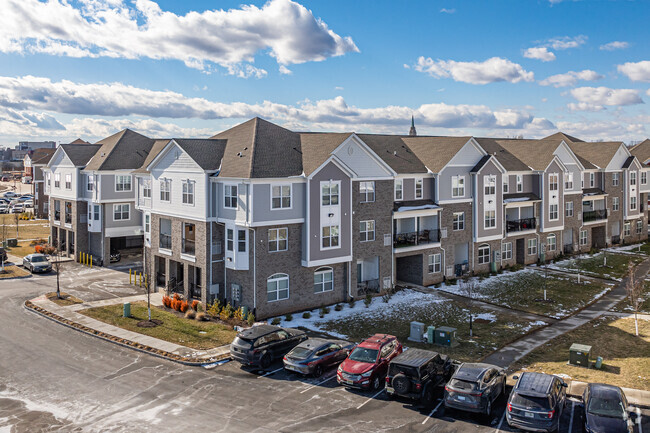 Parking spaces and attached garages line the Harbortown community.