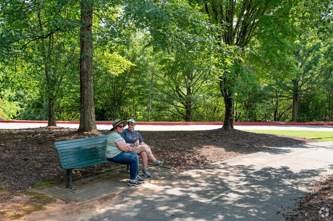 Newtown Park features benches along the walking trails in Newtown.