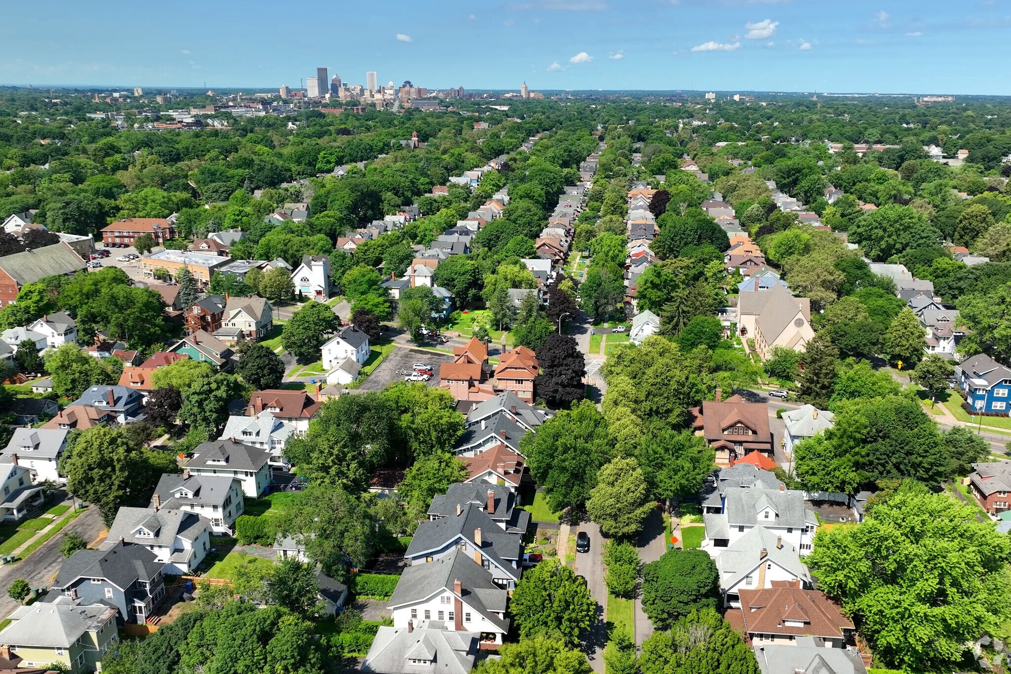 Aerial view of Beechwood with downtown Rochester in the background.