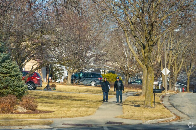 Residents walk along the well-maintained sidewalks of Wexford Village.