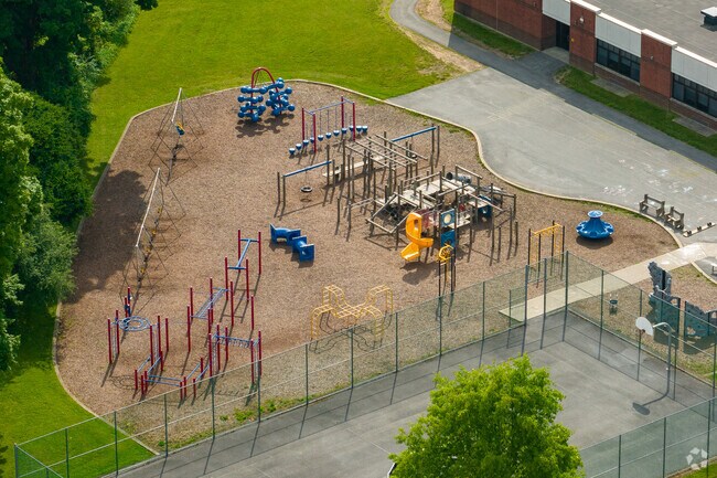 Mannsville Manor Elementary features a large playground for students.