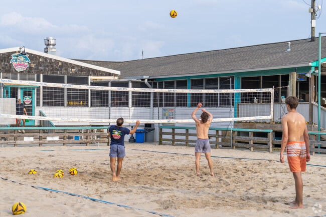 Locals from North College enjoy an evening of volleyball at 
Capt'n Bill's Backyard Grill.