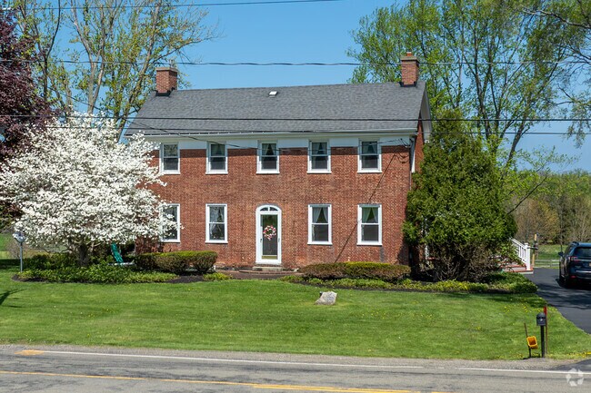 Brick style colonial homes on private wooded lots can be found in Sheridan.