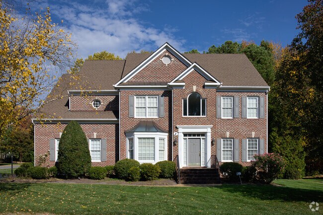 Stately brick homes with attractive details are a staple of the Twin Hickory neighborhood.