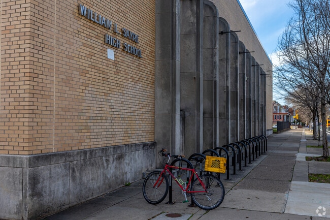 Bike to William L. Sayre High School and lock up on the racks in front of the entrance.