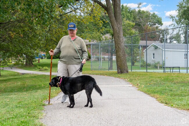 Residents enjoy the mile-long walking trail at Ashland City Park.