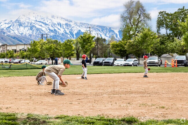 Young baseball players are focused while playing at Holladay Park in Holladay.