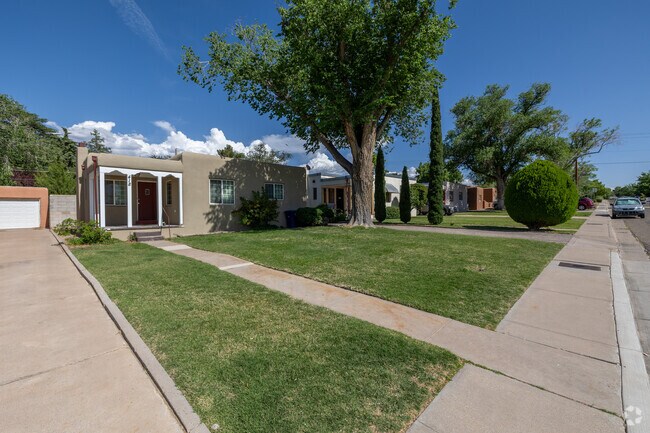 Neatly trimmed lawns line this classic cottage-style home in Nob Hill.