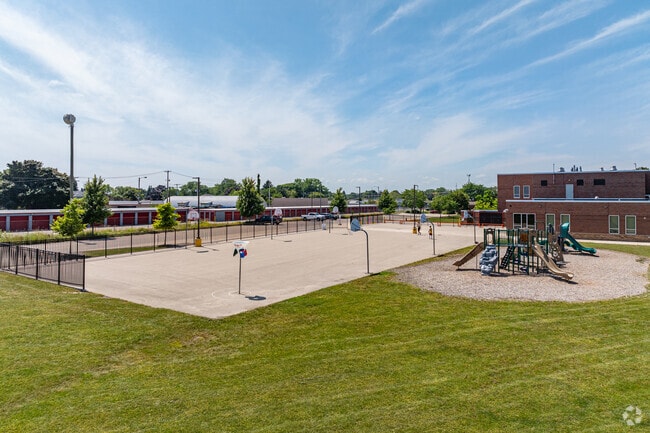 Basketball courts stand near the playground at Knapp Elementary School.