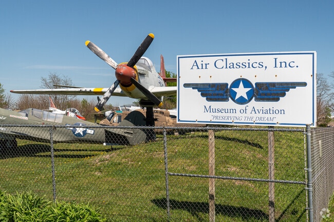Aircraft and vehicles from the 1930s on display at the Museum of Aviation.