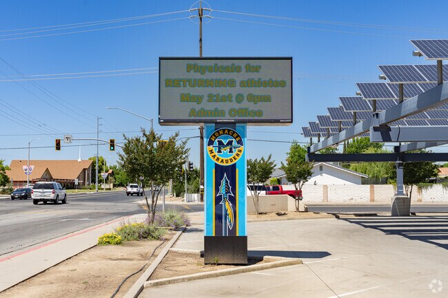 A lighted marquee at the corner of Monache High School informs parents of upcoming events.