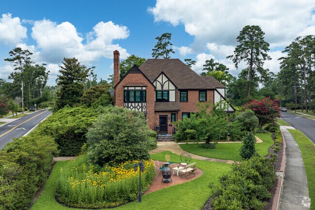 A Tudor inspired mansion sits on a corner lot in Forest Hills North.