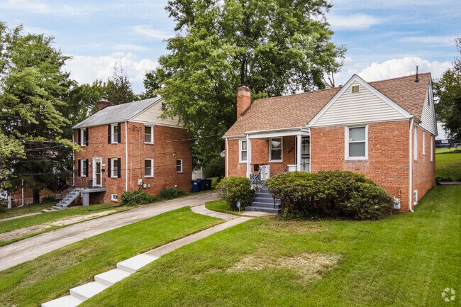 Brick colonial homes sit between many cottages in Forest Heights.