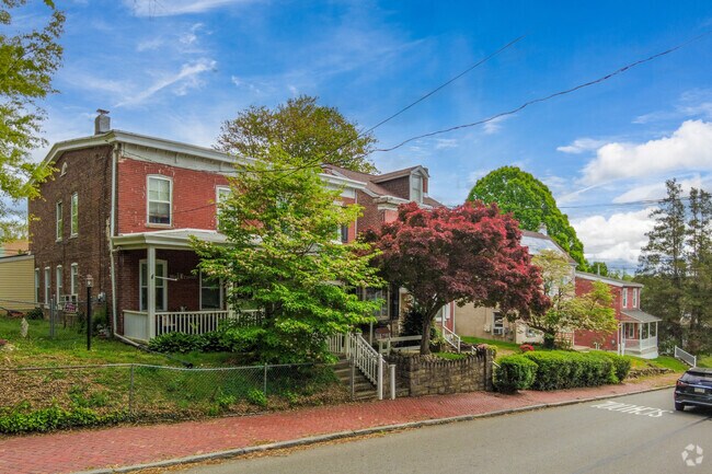 The hilly streets of Upland are lined brick colonial homes and old brick sidewalks.