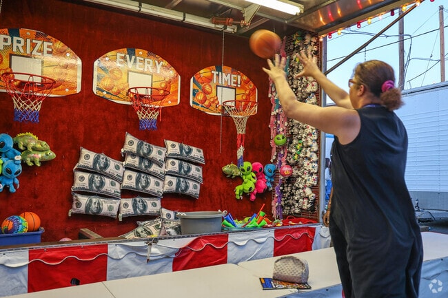 Carnival games bring smiles to the crowds at the Feast of Three Saints.
