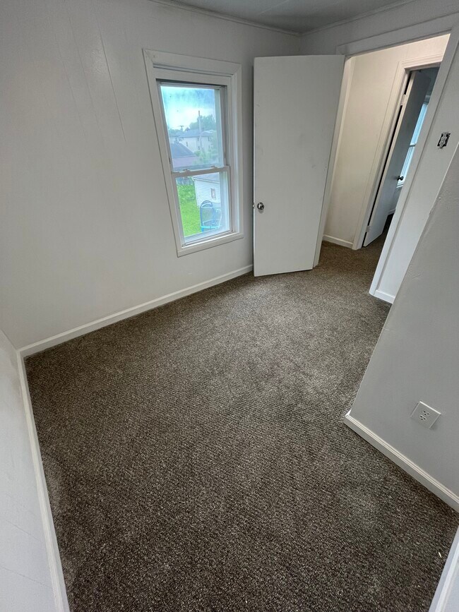 Office/storage room with brand new carpet