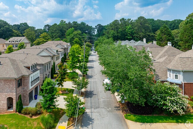 Toco Hills is covered with lush green trees.