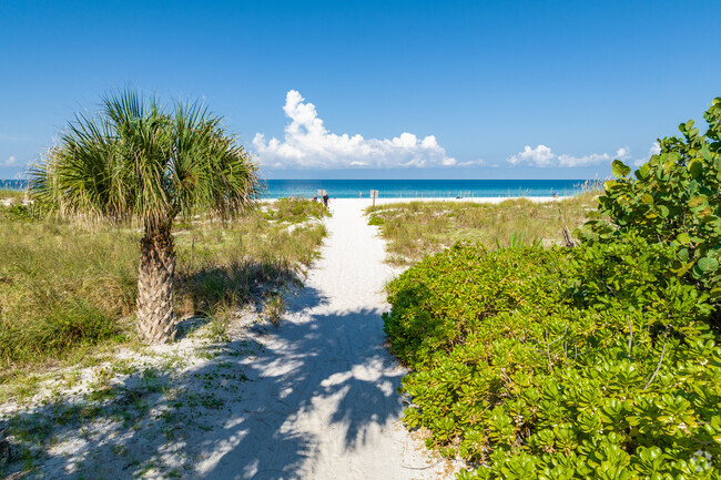 Smell the ocean breeze as you walk through the white sand in Bradenton Beach.