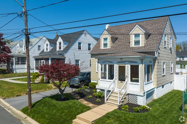 Well Manicured Cape Cod With An Enclosed Front Porch