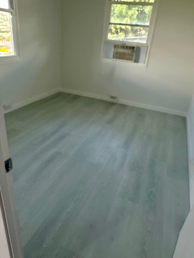 New 8mm luxury vinyl plank (LVP) flooring installed.