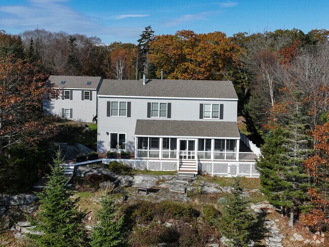 Homes are among the forest and shore on Long Island.