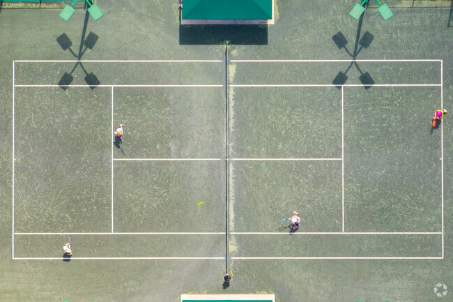 Tennis players enjoy a match at the Palma Ceia Golf and Country Club.