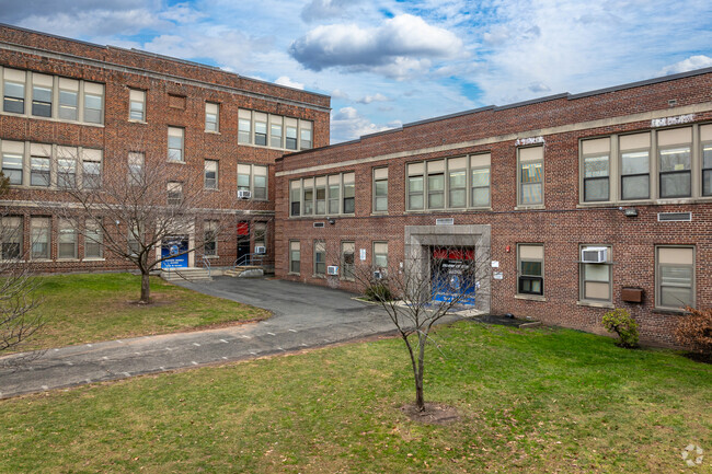 Multiple entrances are present for different grades at Maxson Middle School, Plainfield, NJ.