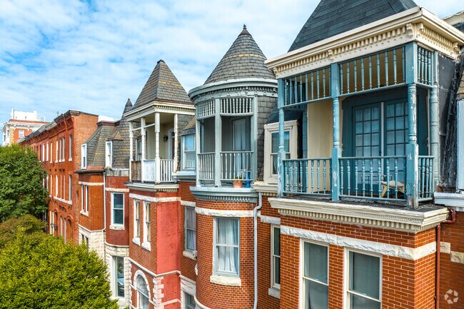 Enjoy your balcony in Druid Heights' Victorian style row homes.