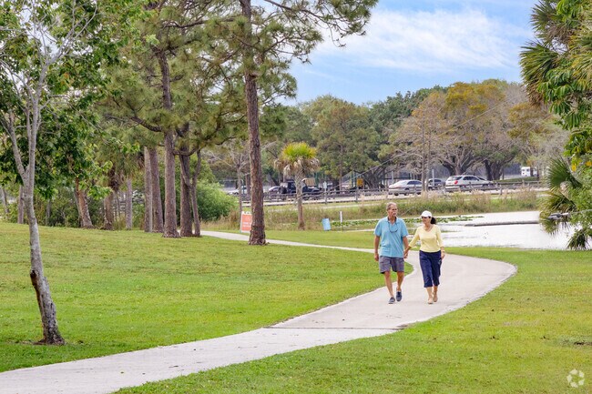 A Palm Beach Ranchettes couple is enjoying a scenic afternoon stroll in the neighborhood.