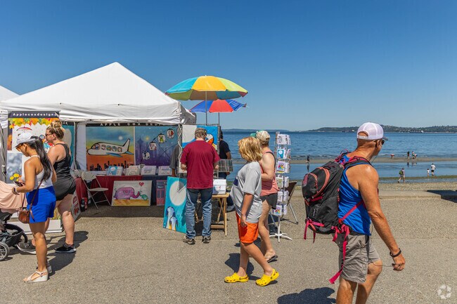 The colorful booths at the Alki Art Fair lined up against the shores of Alki Beach are a sight.