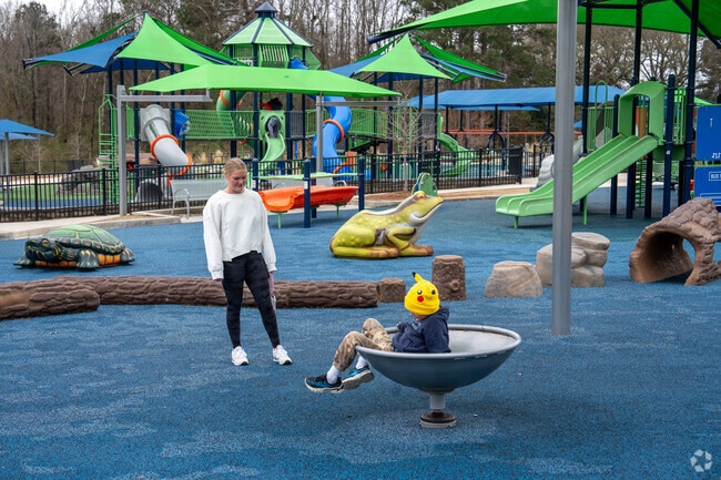Play all day on the inclusive playground at Town Creek Park near Wrights Mill Estates.