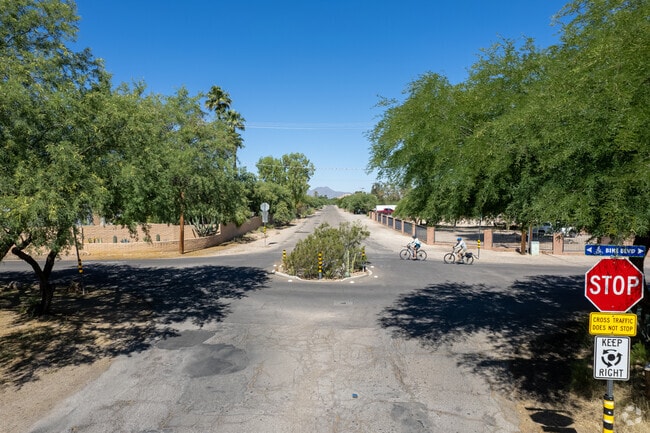 Bicyclists ride through the Rillito Bend neighborhood.