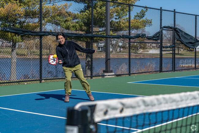 Residents of High Point Park enjoy access to multiple tennis and pickleball courts.