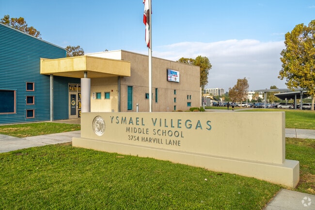 The entrance of Ysmael Villegas Middle proudly showcases its name on prominent signage.