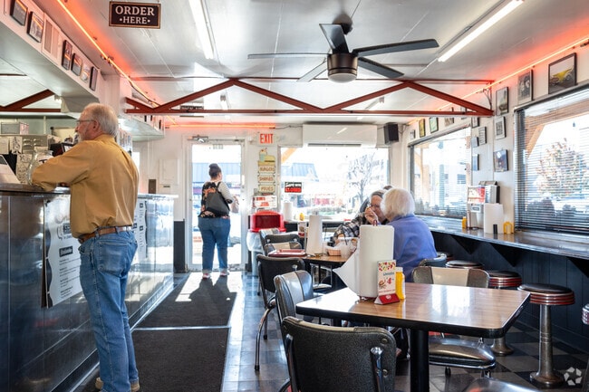 Vintage pictures line the walls of this  family-owned stop for burgers, hot dogs & shakes.