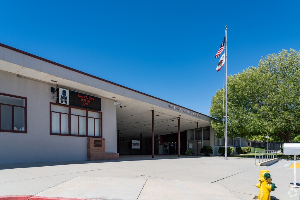 The flag flies high in front of Maricopa Sr High School.