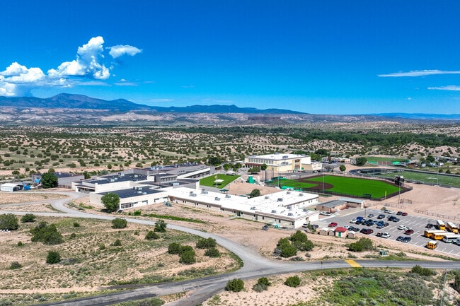 Pojoaque High School with the Jemez Mountains in the distance.