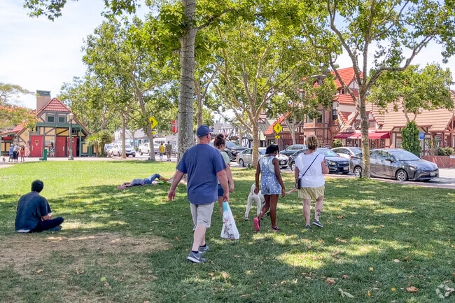Rest in the shady green space of Solvang Park.