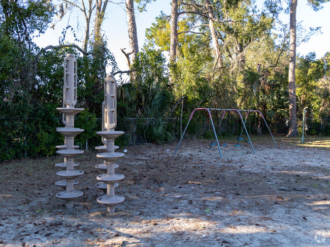 Swings and climbing structures are on the playground at Central Riverside Elementary School.