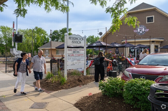 Commuters do a little shopping at Herrington Station before heading home near Nelson Lake.