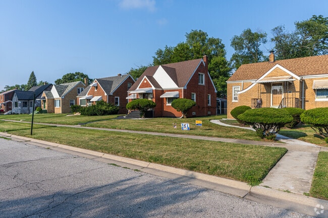 Glen Park residents decorate their manicured front lawns with spruces.