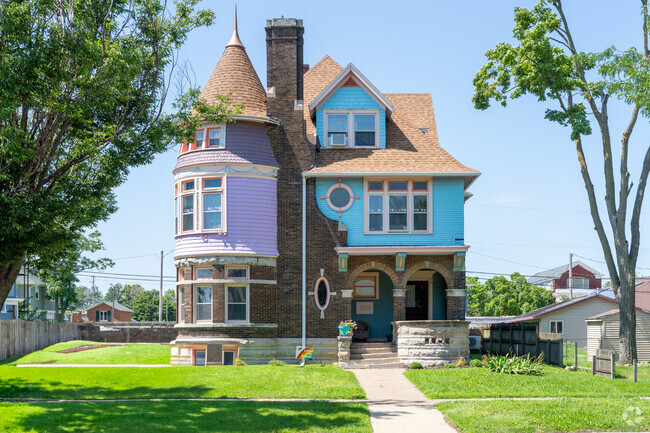 This colorful Victorian-style home is just one of many artsy homes in Wellington Heights.