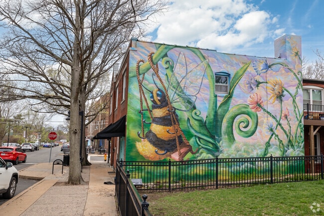 A Bee Named Bubbles adorns this wall of a candy store in Clayton.