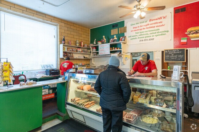 Residents of The Hill pack into Eovaldi's Deli for lunch.