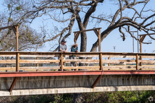 Stephenville locals enjoy the park bridge, a perfect spot to relax.